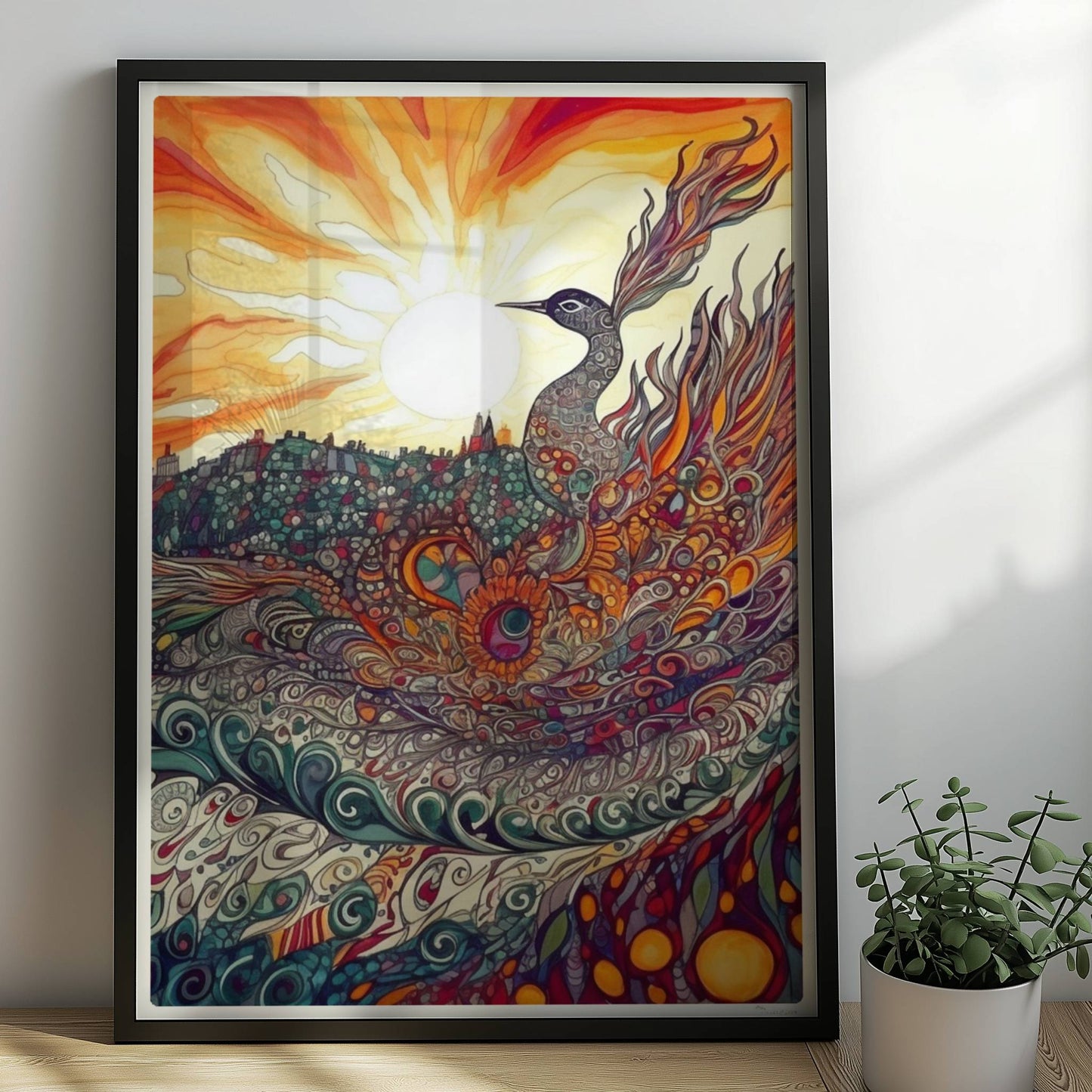 Phönix mit prachtvollen, ornamentalen Federn in leuchtenden Farben, vor einer Sonnenuntergangslandschaft im Jugendstil.. Rahmen schwarz 50x70