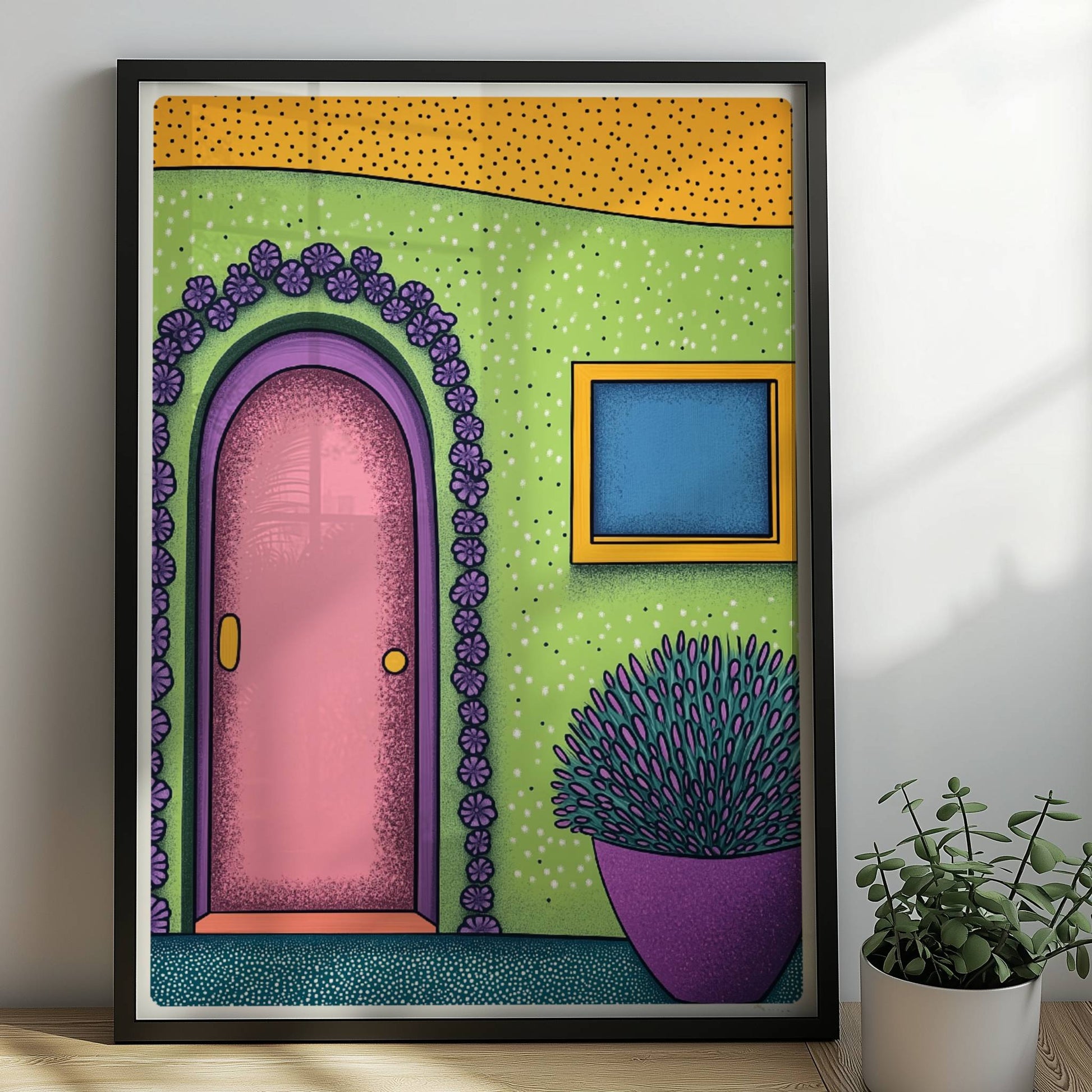 Grüne Fassade mit rosa Haustür, Blumenrahmen und lila Pflanze im Topf – farbenfrohes Reisemotiv mit mediterranem Flair. Rahmen schwarz 50x70