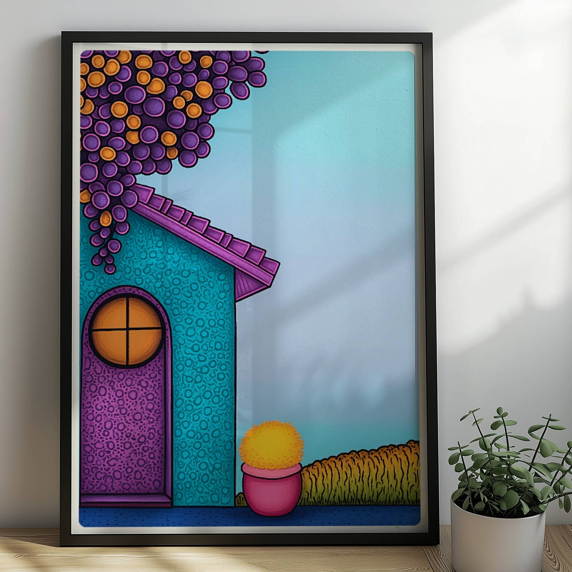 Türkise Hausfassade mit runder lila Tür, hängenden roten Trauben und gelbem Blumentopf – fröhliches mediterranes Urlaubsmotiv.. Rahmen schwarz 50x70
