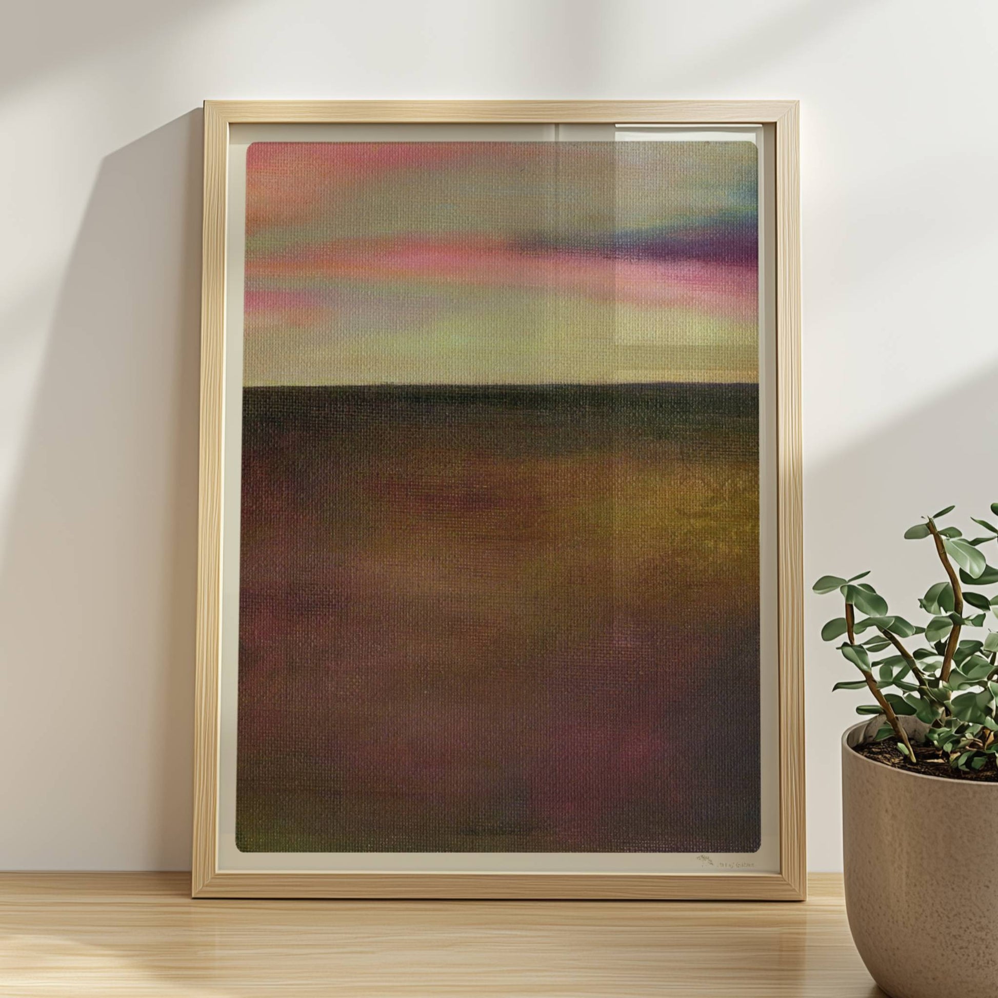 Einzelner goldener Tropfen vor farbigem Wolkenhimmel, surreal.. Rahmen natur 30x40