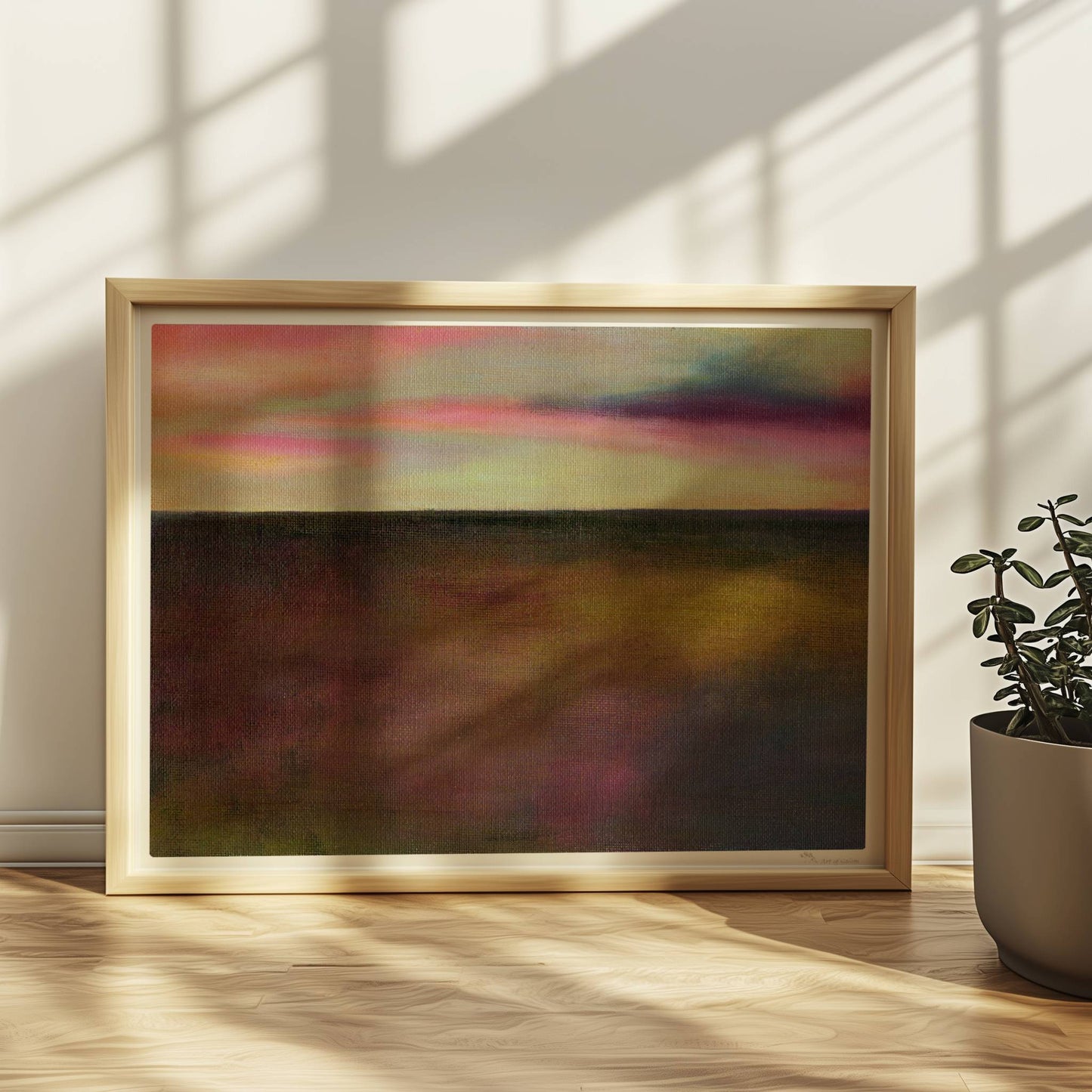 Einzelner goldener Tropfen vor farbigem Wolkenhimmel, surreal.. Rahmen natur 40x30