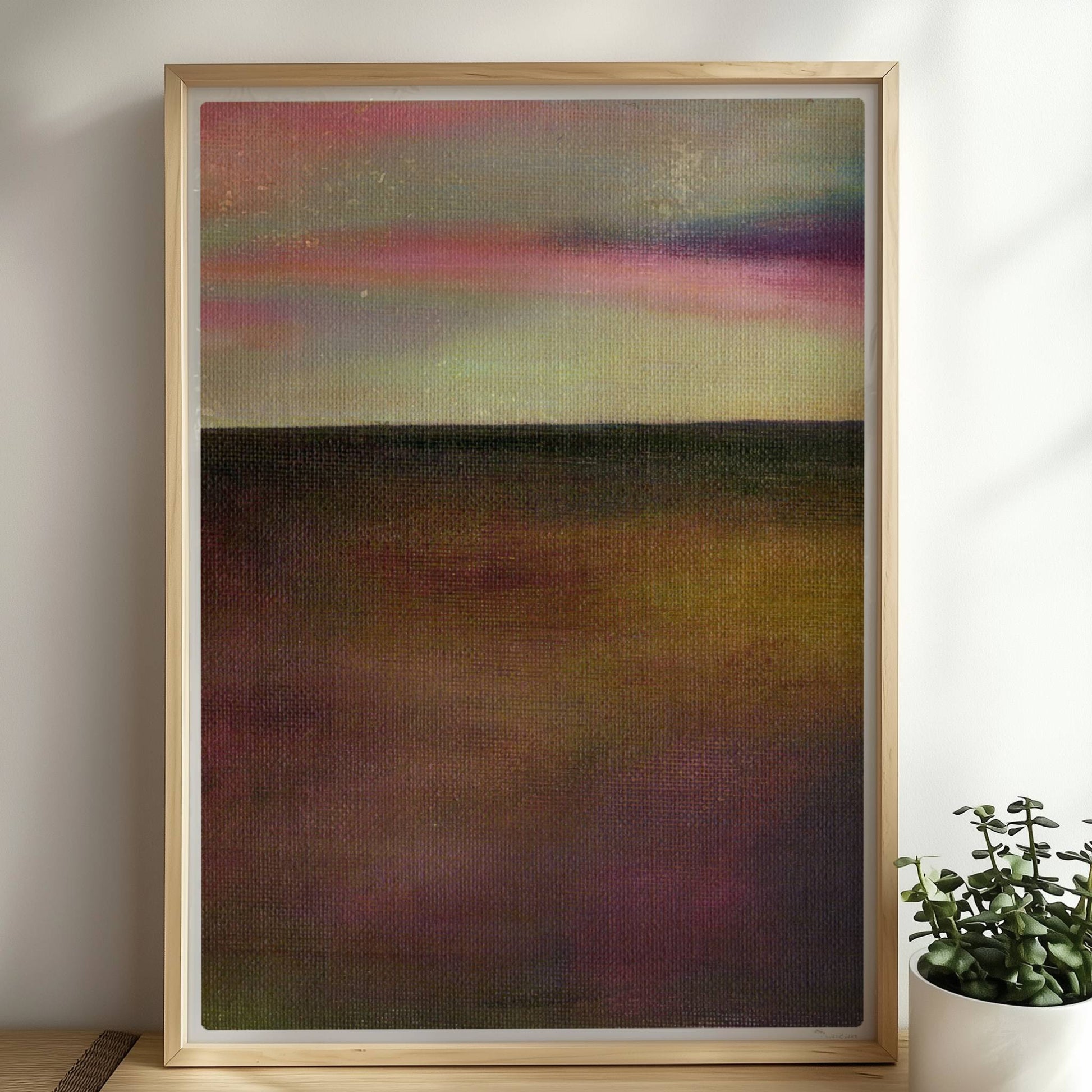 Einzelner goldener Tropfen vor farbigem Wolkenhimmel, surreal.. Rahmen natur 50x70