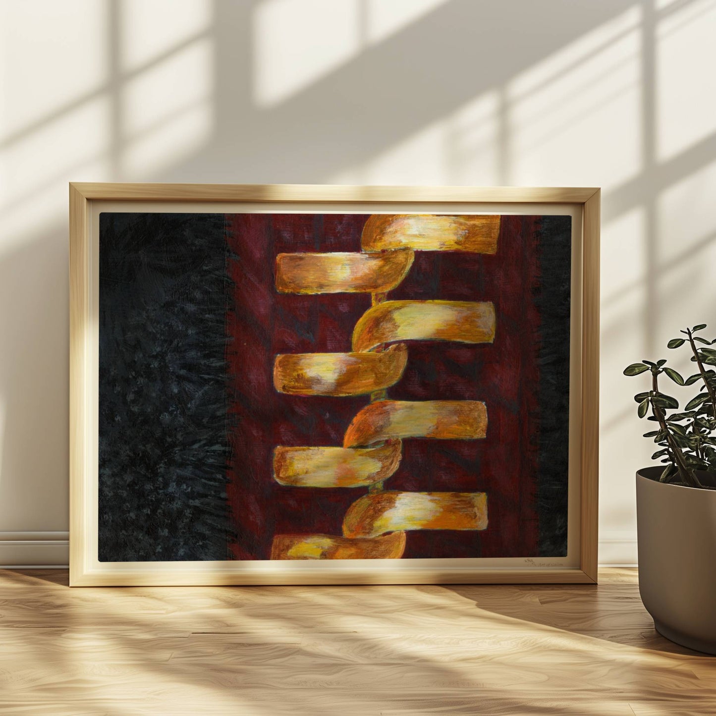 Goldene abstrakte Kette auf rotem Stoffhintergrund – modisch und modern.. Rahmen natur 40x30