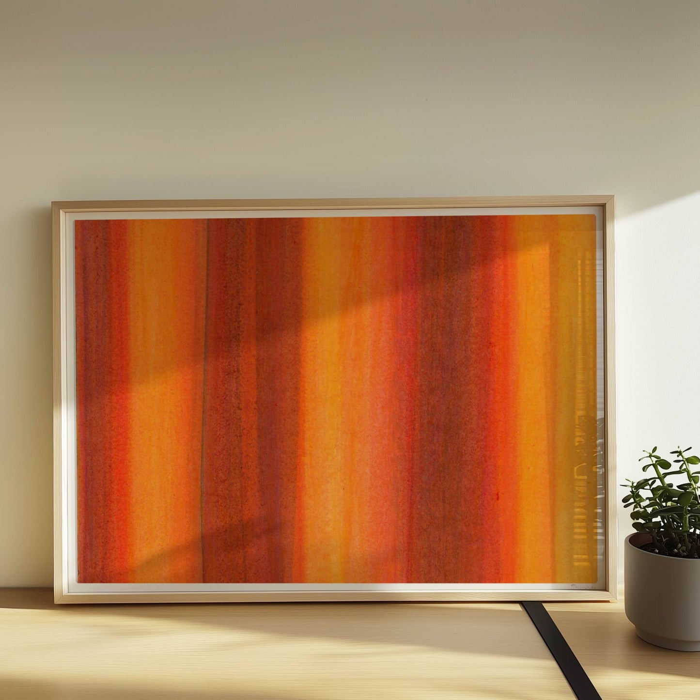 Vertikale Streifen in leuchtendem Orange, Rot und Gelb erzeugen eine abstrakte Wandwirkung mit Wärme und Energie.. Rahmen natur 70x50