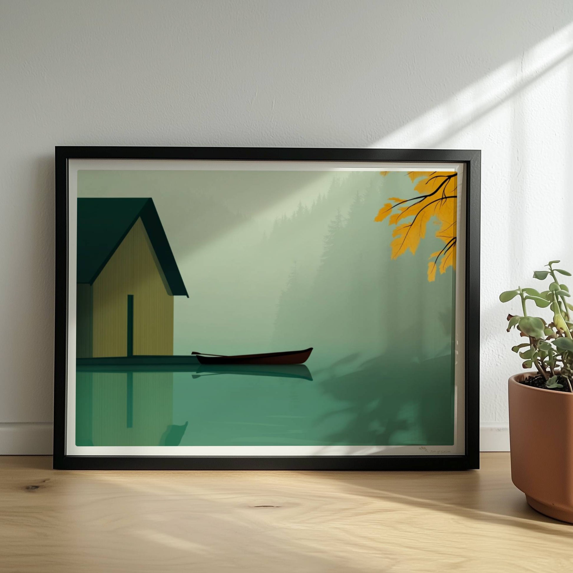 Stillleben eines Bootshauses mit Ruderboot auf einem nebligen See, eingerahmt von gelbem Herbstlaub.. Rahmen schwarz 40x30