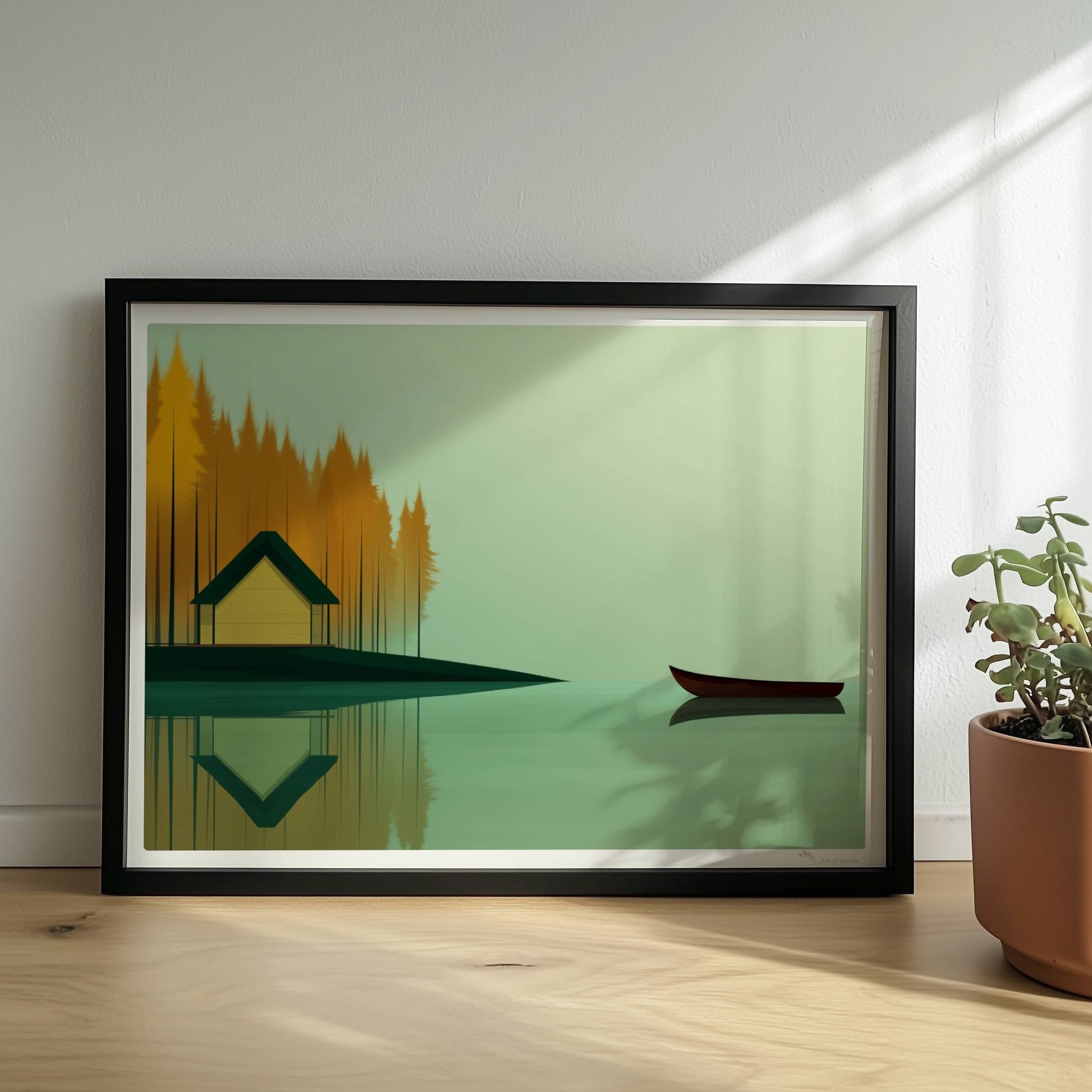 Gelbes Häuschen am See mit grünem Dach, umgeben von herbstlichen Bäumen und einem ruhigen Kanu auf spiegelndem Wasser.. Rahmen schwarz 40x30