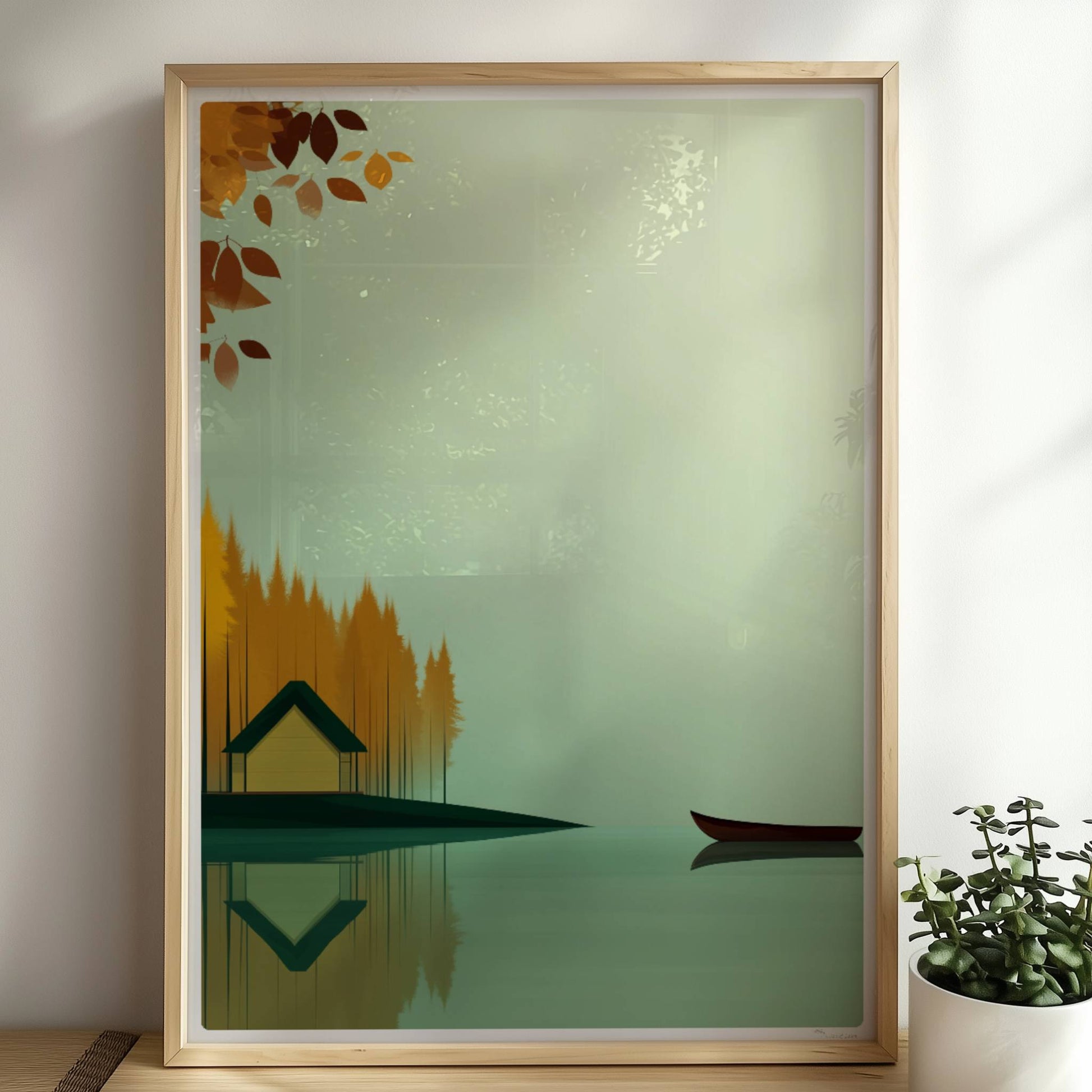 Gelbes Häuschen am See mit grünem Dach, umgeben von herbstlichen Bäumen und einem ruhigen Kanu auf spiegelndem Wasser.. Rahmen natur 50x70