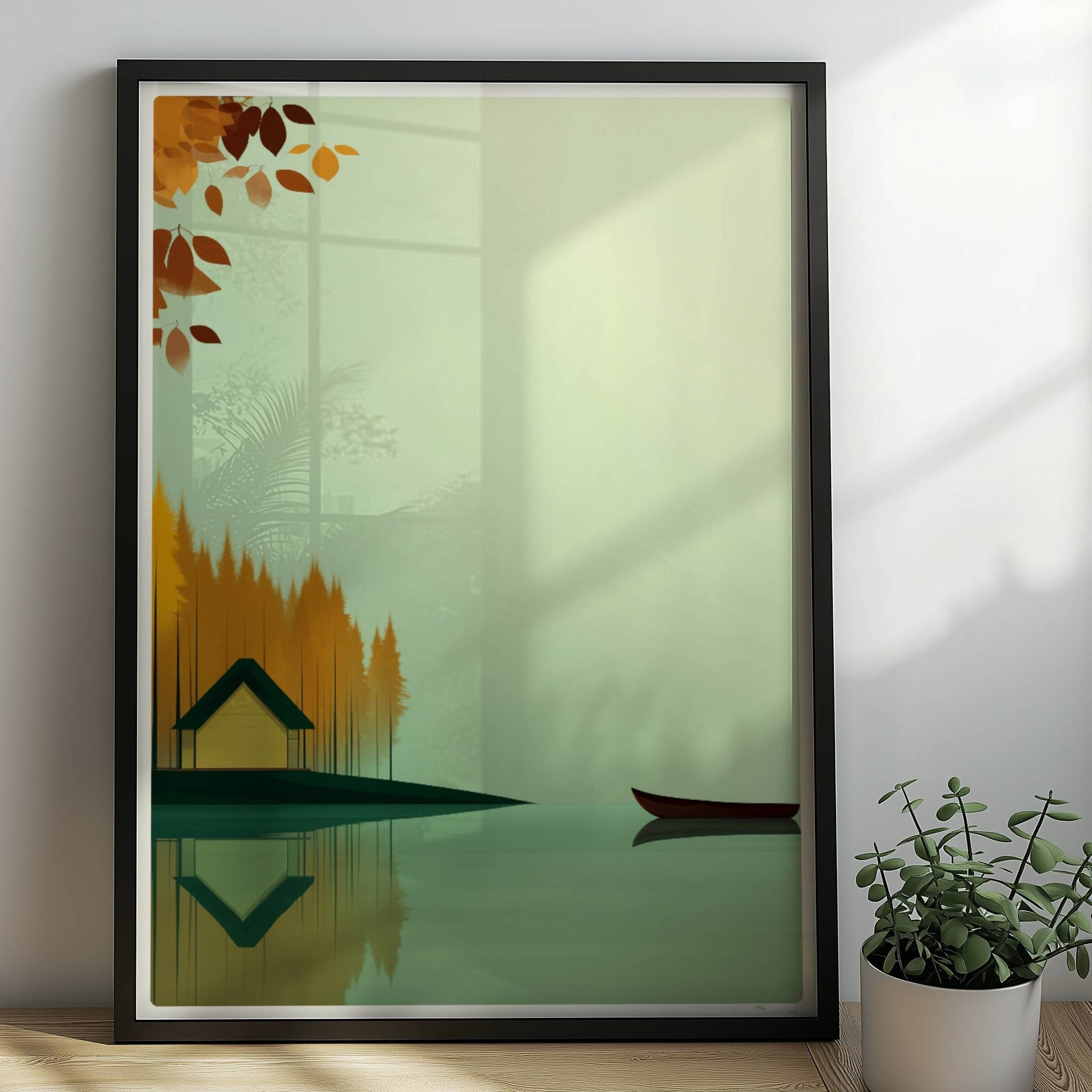 Gelbes Häuschen am See mit grünem Dach, umgeben von herbstlichen Bäumen und einem ruhigen Kanu auf spiegelndem Wasser.. Rahmen schwarz 50x70